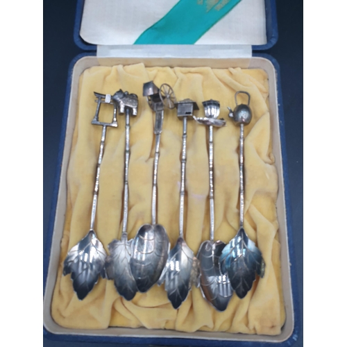 99 - A Set of six Asahi Shoten sterling silver Spoons with leaf bowls and figural finials, in case