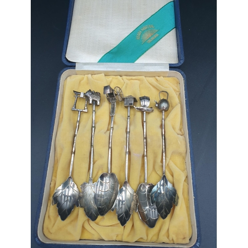 99 - A Set of six Asahi Shoten sterling silver Spoons with leaf bowls and figural finials, in case