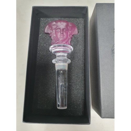 389 - A Versace amethyst Bottle Stopper in the form of a mask, 5 1/4in boxed