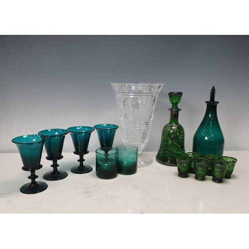 388 - A quantity of green glass including Decanters, Wines, small Beakers and a clear glass Pedestal Vase ... 