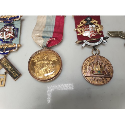 396 - A collection of mainly Masonic Interest jewels, medals & badges, to include two 9ct gold examples al... 