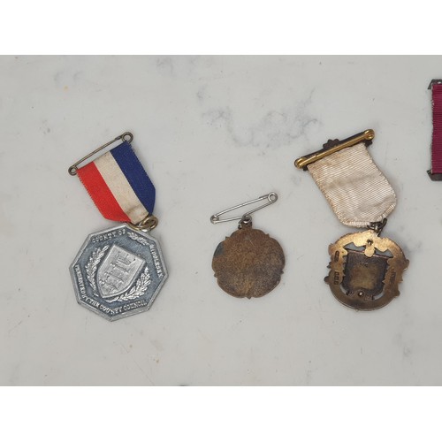 396 - A collection of mainly Masonic Interest jewels, medals & badges, to include two 9ct gold examples al... 