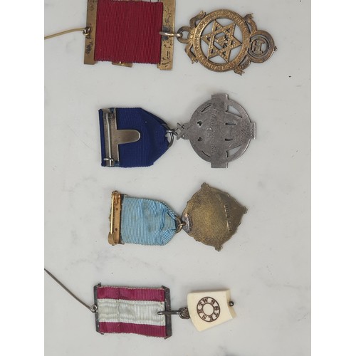 396 - A collection of mainly Masonic Interest jewels, medals & badges, to include two 9ct gold examples al... 