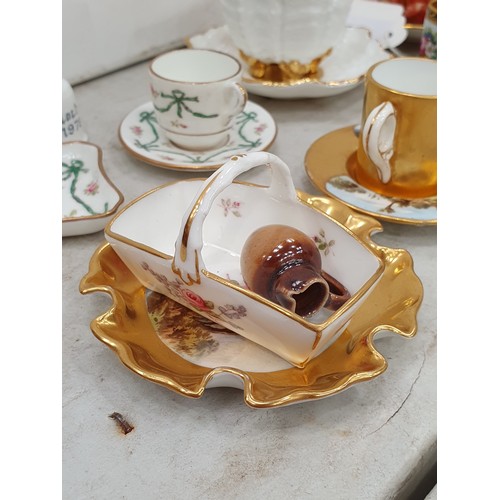 A quantity of miniature Cups, Saucers and Mugs, mostly Coalport, many