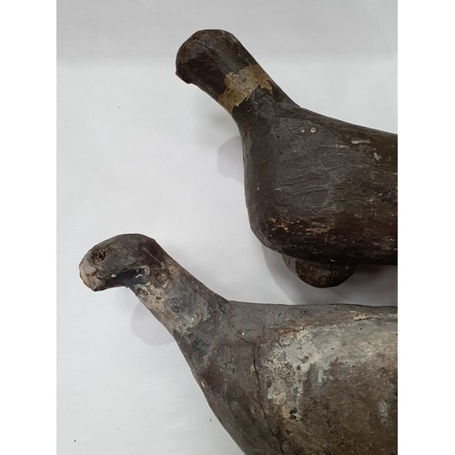 15 - Two naïve and primitive painted wooden Folk Art Pigeon Decoys one on stand, A/F.