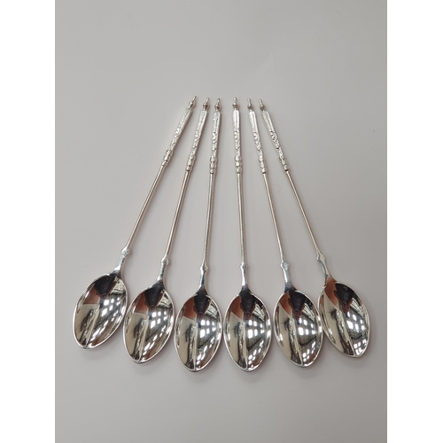 88 - Three Sets of six silver Coffee Spoons, two with trefid finials and rat tail bowls, London 1897, She... 