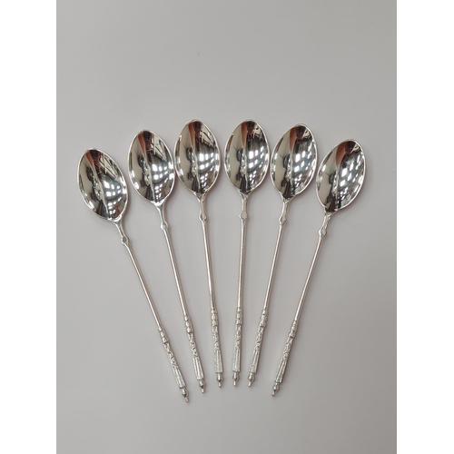 88 - Three Sets of six silver Coffee Spoons, two with trefid finials and rat tail bowls, London 1897, She... 