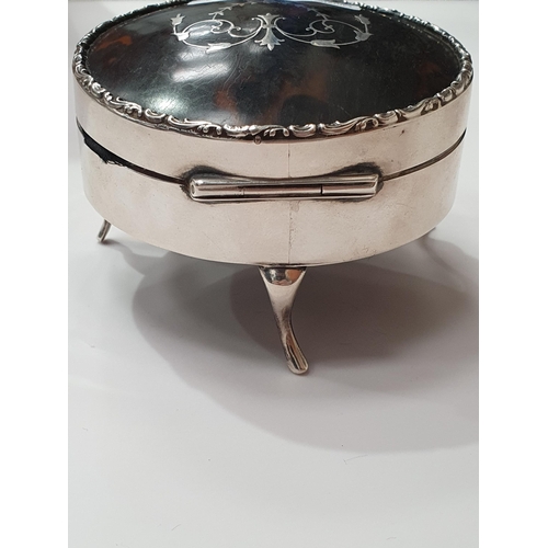 90 - A George V silver and tortoishell circular Trinket Box with pique swag and pendants on cabriole supp... 