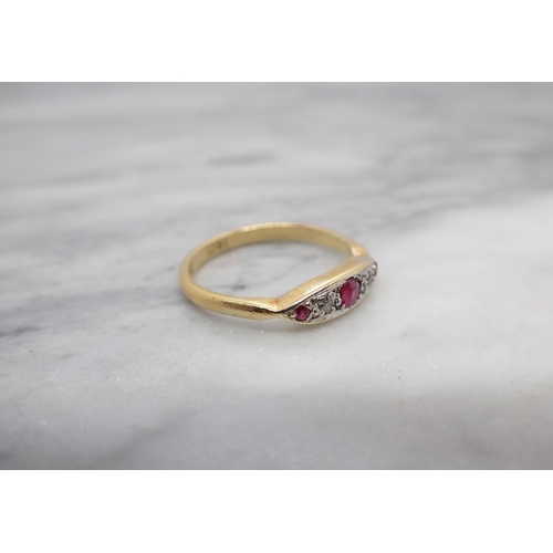 158 - A Ruby and Diamond five stone Ring pavé-set three graduated round rubies interspersed with two eight... 