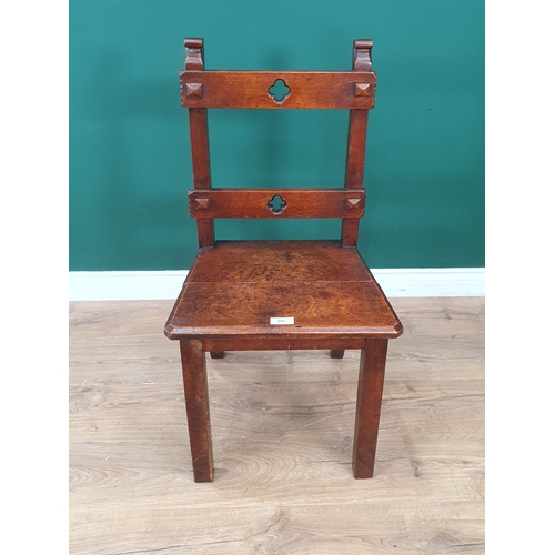 563 - A Victorian oak bar back Single Chair with gothic style designs.