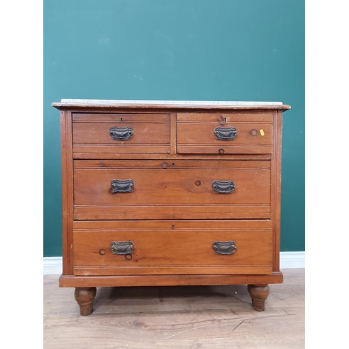 10 - A stained pine Chest of two short, two long Drawers with marble top, raised on turned bun feet A/F, ... 