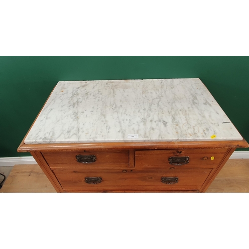 10 - A stained pine Chest of two short, two long Drawers with marble top, raised on turned bun feet A/F, ... 