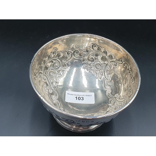 103 - An Edward Vll silver Bowl with floral and scroll embossing, vacant cartouches