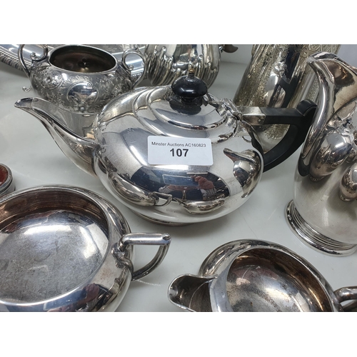 106 - A George V silver three piece circular Condiment Set with gadroon arms, Sheffield 1914/15 and anothe... 