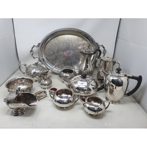 106 - A George V silver three piece circular Condiment Set with gadroon arms, Sheffield 1914/15 and anothe... 