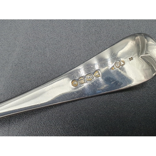 135 - A George IV silver Sifting Ladle, old English pattern, London 1828, maker: F.H., and another, simila... 