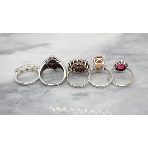 198 - Four silver Dress Rings set various stones and a white metal Dress Ring set paste