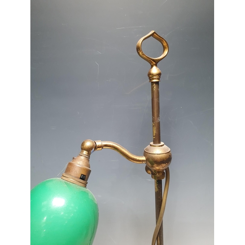 2 - An adjustable brass Table Lamp with green glass shade, on ribbed, weighted circular base, 1ft 9