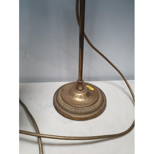 2 - An adjustable brass Table Lamp with green glass shade, on ribbed, weighted circular base, 1ft 9