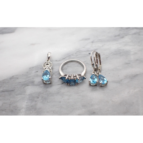 207 - A Dress Ring stamped 925 set pear-cut blue topaz with Pendant and drop Earrings en suite