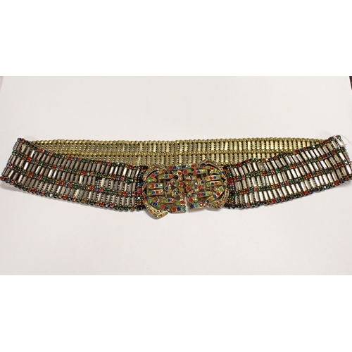 232 - A 1930's paste-set Belt set numerous coloured stones in gilt metal, stones deficient