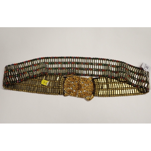 232 - A 1930's paste-set Belt set numerous coloured stones in gilt metal, stones deficient