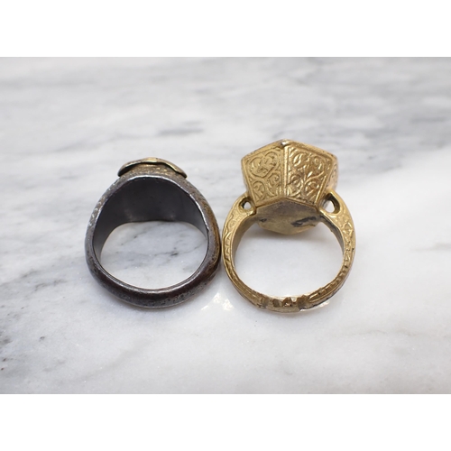 235 - Two seal Rings in yellow metal, one set hardstone