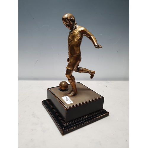 249 - A brass Figure of a footballer and an ebonised wooden plinth, 11in H