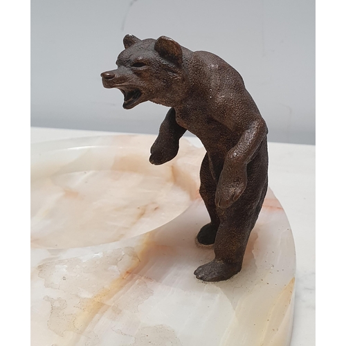 293 - A cold painted bronze figure of a standing bear, mounted on an onyx Ashtray, bear 3in H