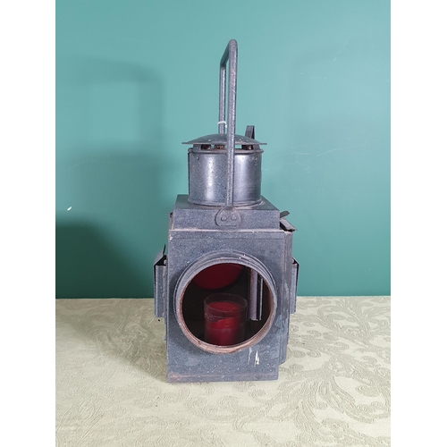 294 - A black painted Railway Lantern with red glass panel, 18in H