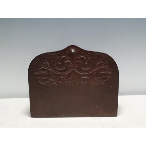 300 - A copper arts and crafts wall mounted open Candle Box, with a typical stylized hammered decoration