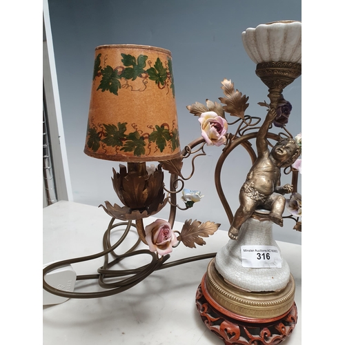 316 - A pair of three branch Table Lamps with trailing rose design and cherub figural support 13in W x 12i... 