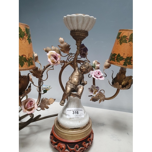 316 - A pair of three branch Table Lamps with trailing rose design and cherub figural support 13in W x 12i... 