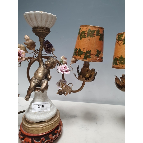 316 - A pair of three branch Table Lamps with trailing rose design and cherub figural support 13in W x 12i... 