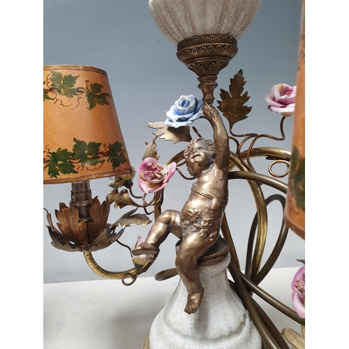 316 - A pair of three branch Table Lamps with trailing rose design and cherub figural support 13in W x 12i... 