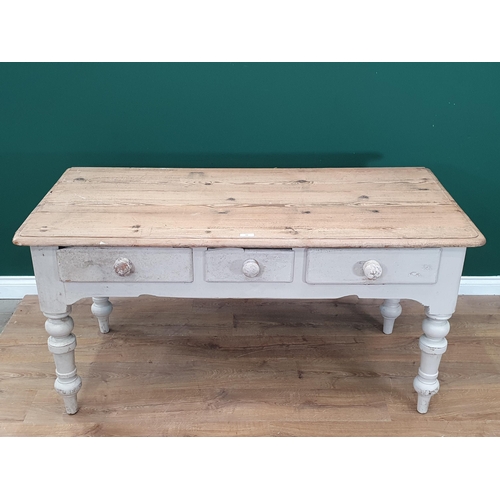 33 - An antique pine scrub top Farmhouse Table with white painted base fitted three frieze drawers on tur... 