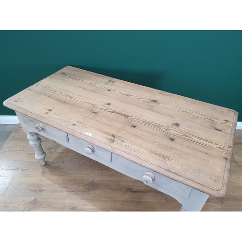 33 - An antique pine scrub top Farmhouse Table with white painted base fitted three frieze drawers on tur... 