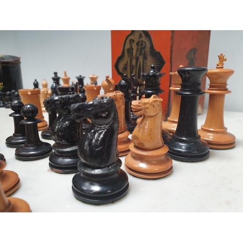 333 - A Staunton style boxwood Chess Set (lacking one pawn) and another boxwood Chess Set, both in tins