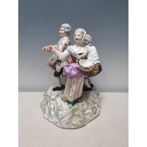 338 - A Continental Figure Group, three figures, one holding a barrel on rustic base and with painted deta... 