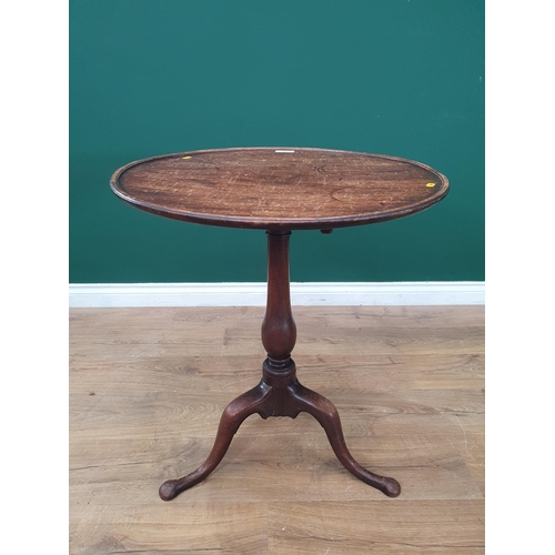 34 - A Georgian mahogany Pillar Table with dished top on baluster turned column and tripod supports 2ft 1... 