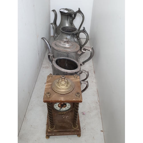 348 - Two pewter Teapots A/F, a plated Teapot, and a Mantel Clock.