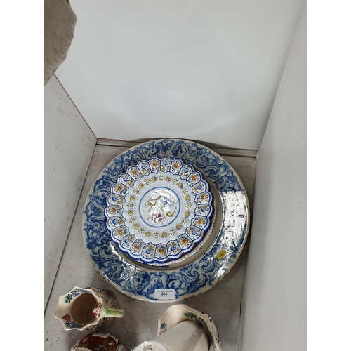 365 - A large blue and white Delft style Charger with scroll and mask rim, with central Armorial Crest A/F... 