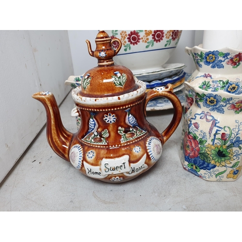 365 - A large blue and white Delft style Charger with scroll and mask rim, with central Armorial Crest A/F... 