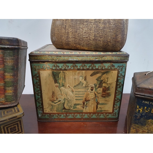 385 - A selection of decorative Tins including a Huntley & Palmer Biscuit Tin in the form of a globe, anot... 