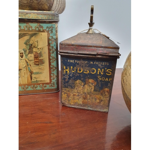 385 - A selection of decorative Tins including a Huntley & Palmer Biscuit Tin in the form of a globe, anot... 