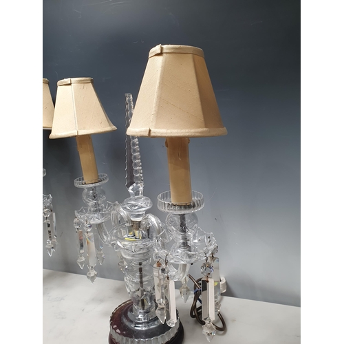 387 - A pair of glass two branch Table Lamps with central tapering finials, 18in H, failed PAT