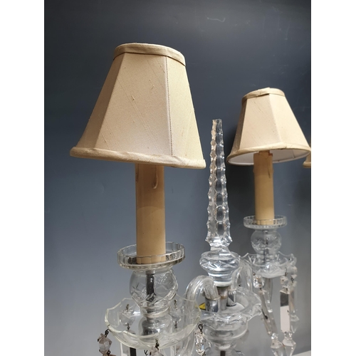 387 - A pair of glass two branch Table Lamps with central tapering finials, 18in H, failed PAT