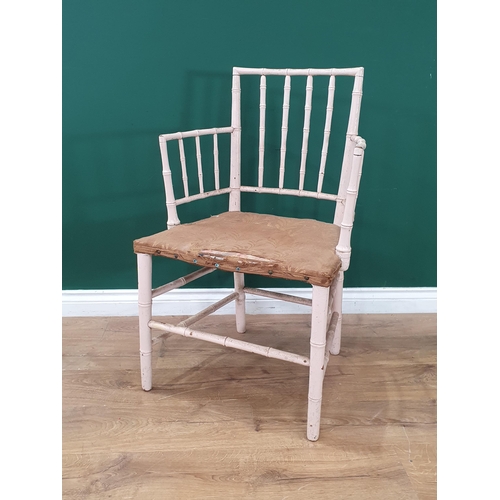 39 - A 19th Century white painted bamboo effect open Elbow Chair