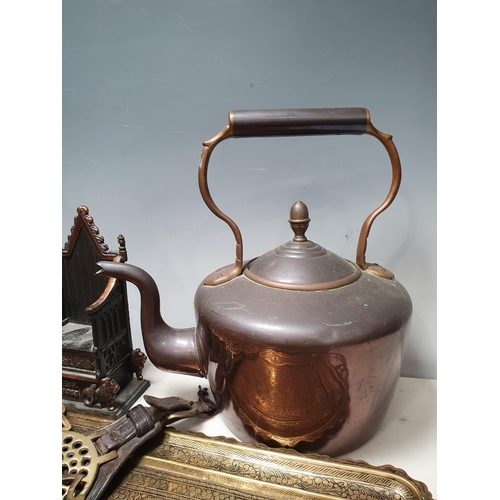 398 - A box containing a copper Kettle, a quantity of Horse Brasses on Martingales, a cast metal Money Box... 