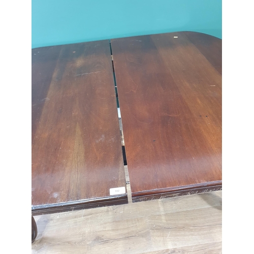 400 - A walnut extending Dining Table on cabriole supports and casters (A/F) with two leaves